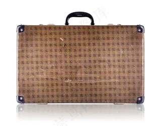 带有花纹的棕黄色手提箱