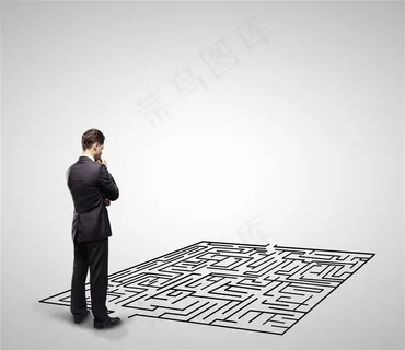 低头思考迷宫的商务人士 低头思考迷宫的商务人士