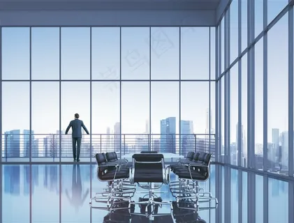 商务大厦里透过玻璃眺望城市的商务人士高清图片