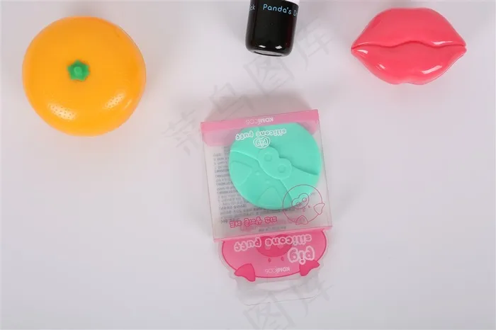 硅胶粉扑与橘子的静物拍摄