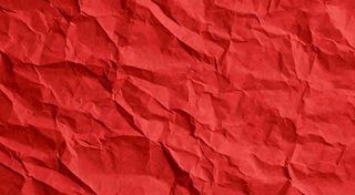 红色褶皱纸张纹理背景