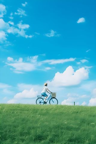 清新草地骑车云朵背景