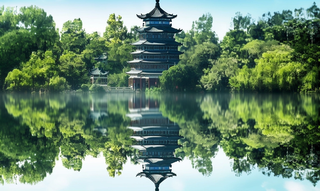 倒影水中的宝塔背后的树木山景风格摄影图