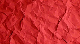 红色褶皱纸张纹理背景