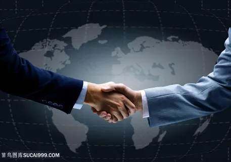 地图背景前商务合作握手手势图片