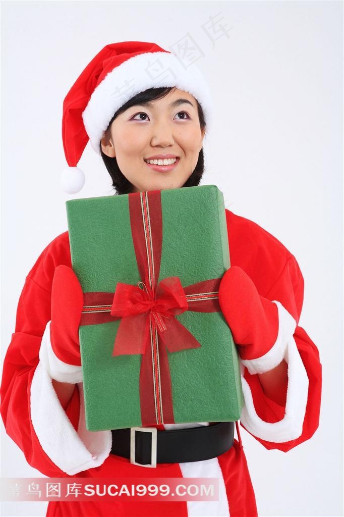 戴圣诞帽微笑拿礼物的圣诞宝贝