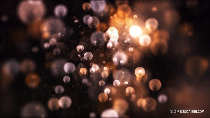 橙色渐变亮片粒子扩散炫光光斑背景