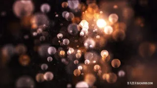 橙色渐变亮片粒子扩散炫光光斑背景