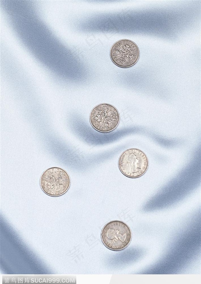 布料上的硬币背景大图