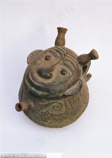 中华传统工艺-褐色的人面玩具