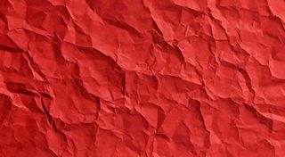 红色褶皱纸张纹理背景