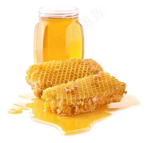 装满玻璃瓶的蜂蜜和流淌的蜂巢蜜高清图片