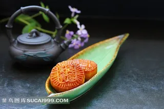 盘装月饼紫砂壶花朵高清图片