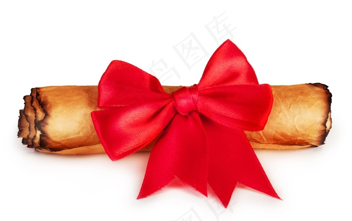 放在牛皮卷轴上的红色蝴蝶结特写高清摄影图片