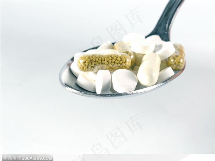 医学药品-调羹中的药丸