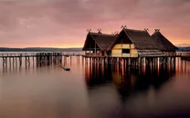 夕阳海岸木屋风景图片