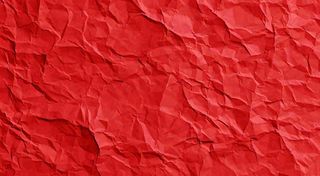 红色褶皱纸张纹理背景