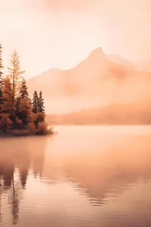 落日雪山云层河面背景