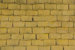 黄色砖墙背景照片