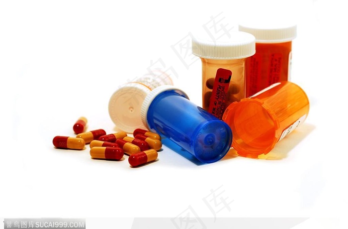 医学药品-倒放的药瓶和药丸