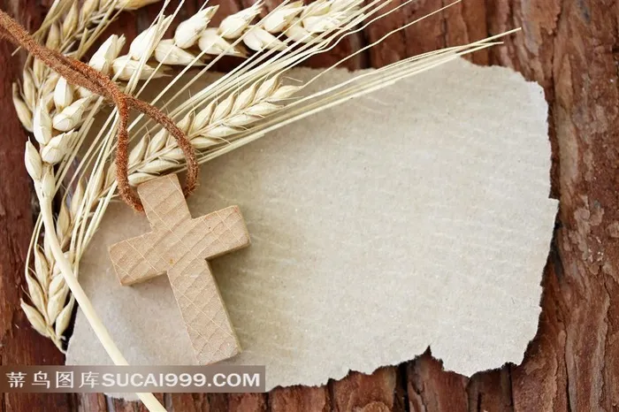 放在撕纸上的麦穗与十字架