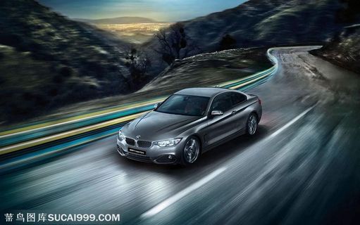 山里公路上行驶的宝马汽车图片素材