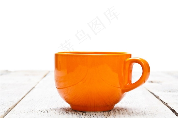 橙色的马克杯近景特写摄影高清图片