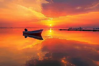 落日海洋沙滩夕阳晚霞摄影图 