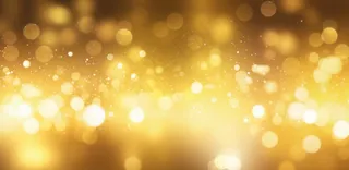 金色闪光颗粒光晕灯光大气耀眼摄影背景图