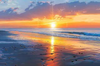 海上日出朝霞云层沙滩海浪摄影图