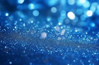 蓝色闪光颗粒光晕灯光摄影背景图