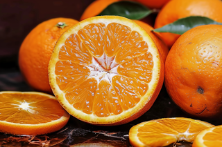 新鲜橙子橘子切片摄影图