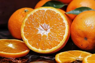 新鲜橙子橘子切片摄影图