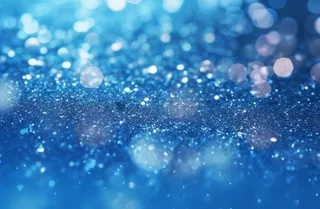 蓝色闪光颗粒光晕灯光摄影背景图