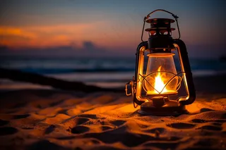 傍晚落日海边沙滩照明灯灯盏摄影图