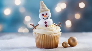 圣诞雪人纸杯蛋糕节日甜点摄影图