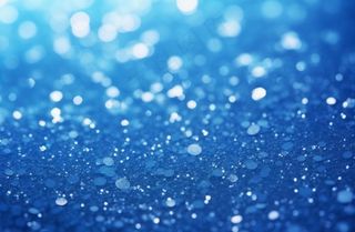 蓝色闪光颗粒光晕灯光摄影背景图