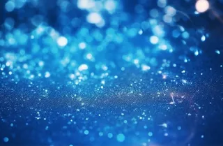 蓝色闪光颗粒光晕灯光摄影背景图