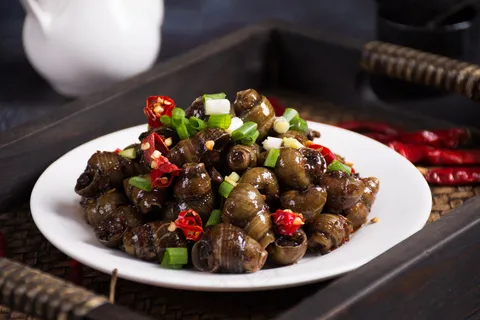 麻辣田螺小吃背景 麻辣田螺小吃背景