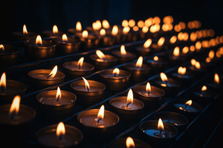 rows of lit candles in a dark room, a picture by Niko Henrichon, pexels, baroque, dark lit candles, lit candles, lit with candles 