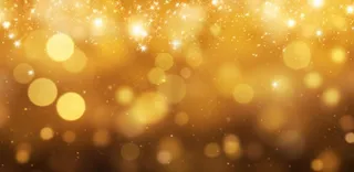 金色闪光颗粒光晕灯光大气耀眼摄影背景图