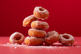 中式甜甜圈油饼子年货美食红色背景甜点摄影图