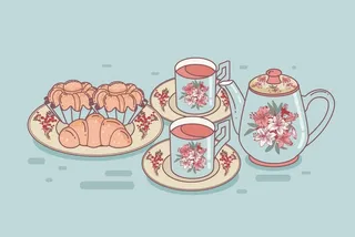 茶杯和奶油蛋卷图片